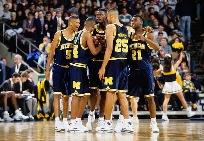 The 1992 Michigan Wolverines basketball team during a timeout.